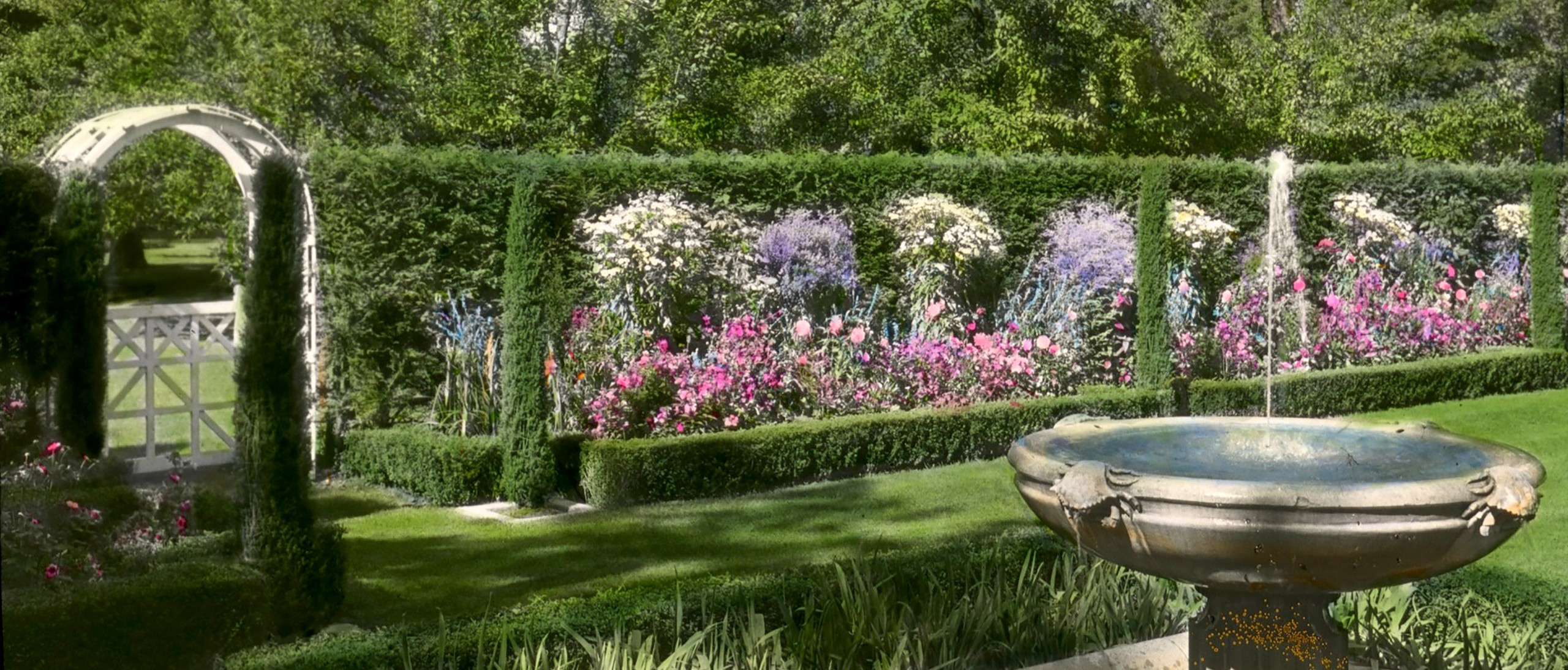 Glass lantern slide of a garden with a fountain at Halcyon Lodge in Lake Forest, IL from the Archives of American Gardens, Garden Club of Amreica Collection