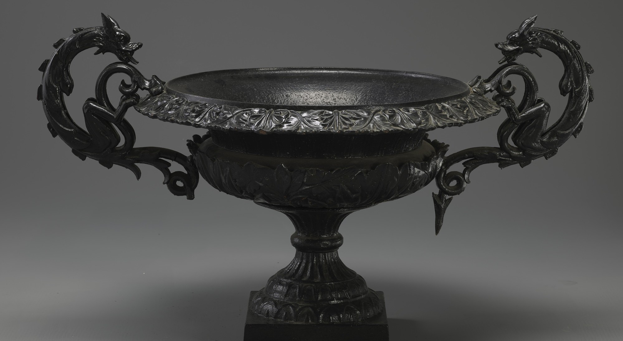 Cast iron urn with dragon detail