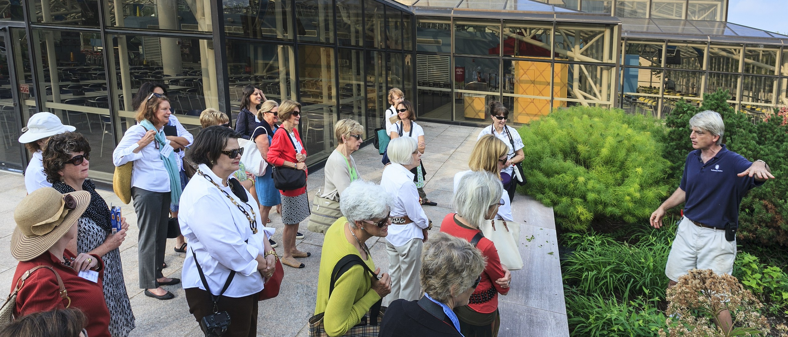 Tour group looking at Air and Space Landscape plantings