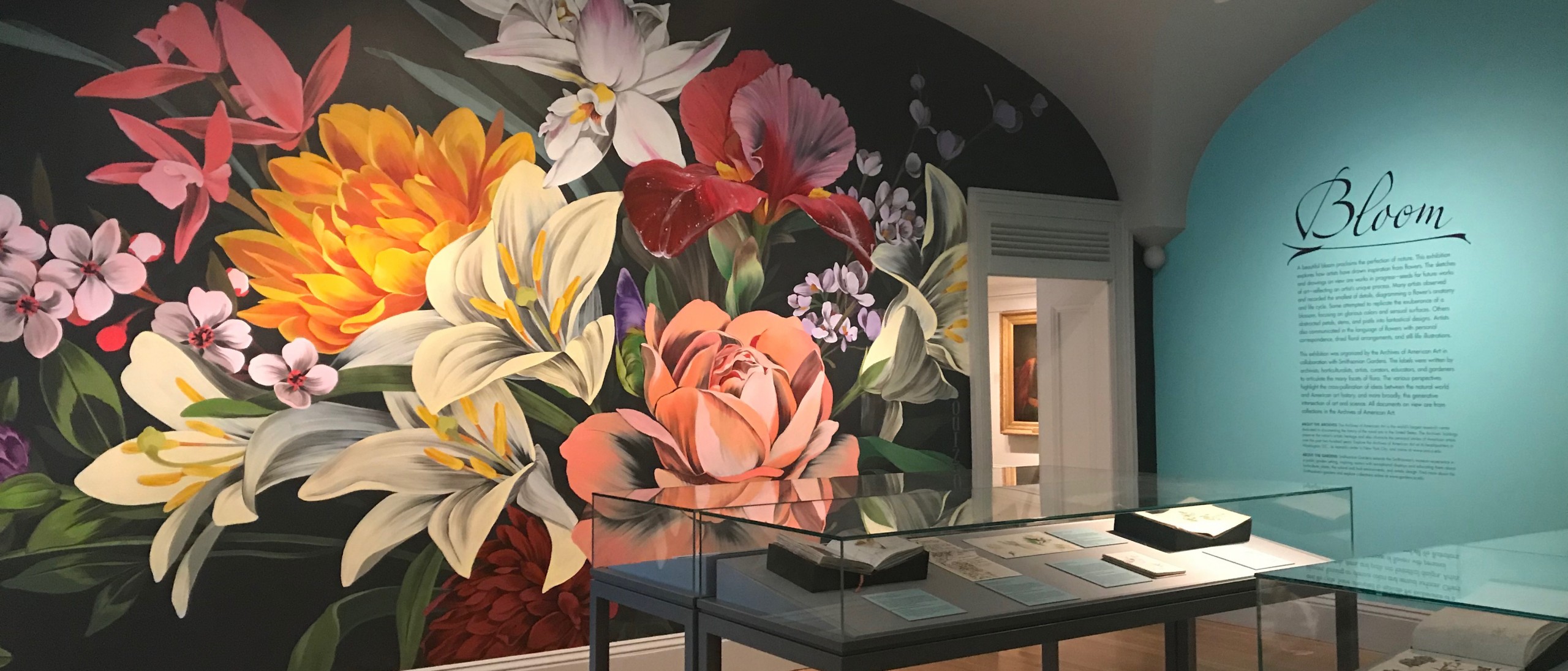 Painted mural of multicolored flowers in exhibit room