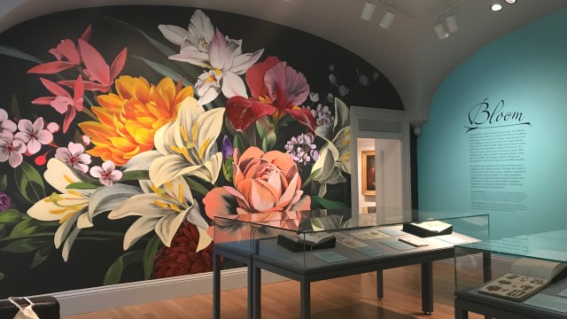 Painted mural of multicolored flowers in exhibit room