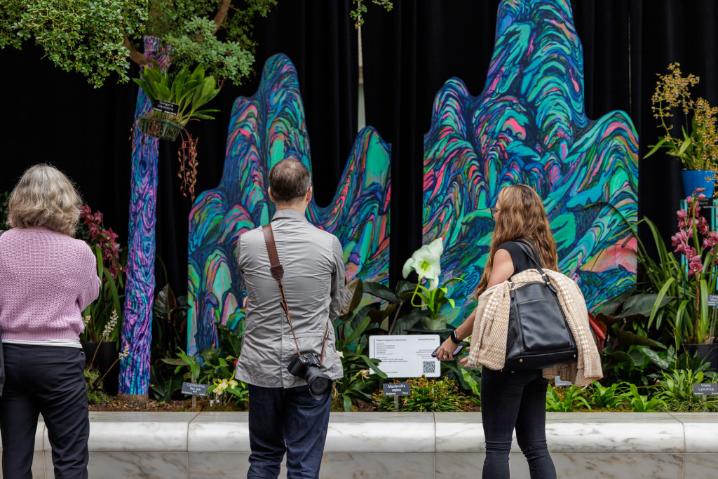 Visitors enjoys The Future of Orchids exhibit