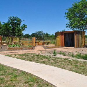 A welcome sign greets visitors to the North Austin Community Garden. © Art in Public Places Program, 2014