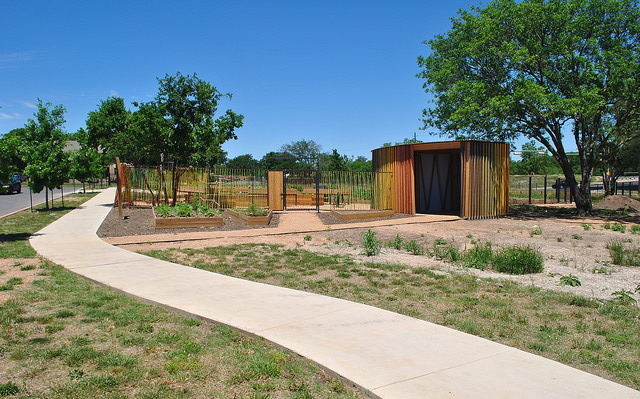 A welcome sign greets visitors to the North Austin Community Garden. © Art in Public Places Program, 2014