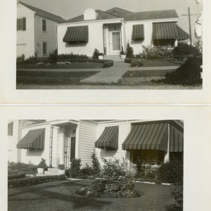 Jeanne Beatrice Alost and Joe Alost III sitting on front lawn with bridal wreath and phlox in bloom