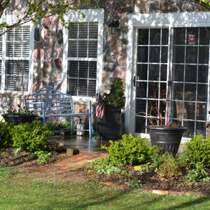 Foundation planting brick patio with French Doors at Never Give Up! garden.