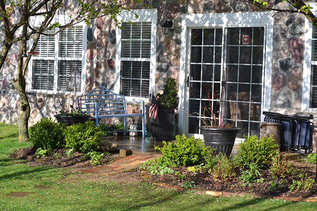 Foundation planting brick patio with French Doors at Never Give Up! garden.