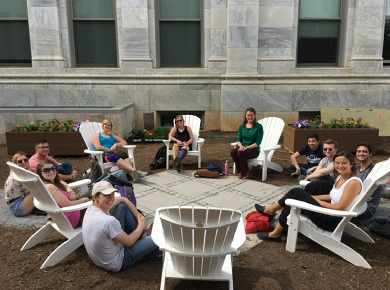 The American University students gather around in the garden