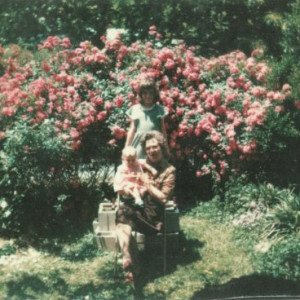 The author's sister in their grandmother's rose garden, Fort Payne, Alabama, 1975.