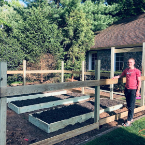 The finished raised beds and fence ready to be installed at Ivan's Garden.