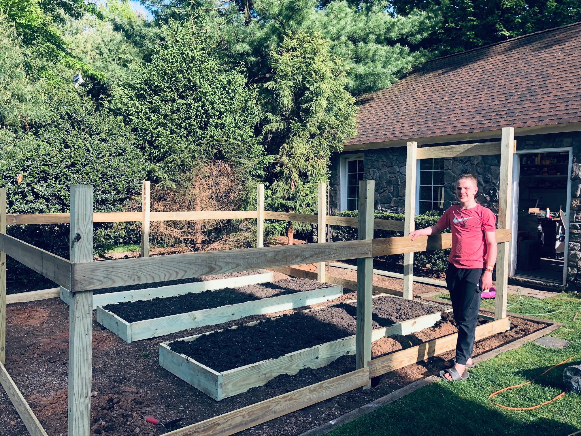 The finished raised beds and fence ready to be installed at Ivan's Garden.