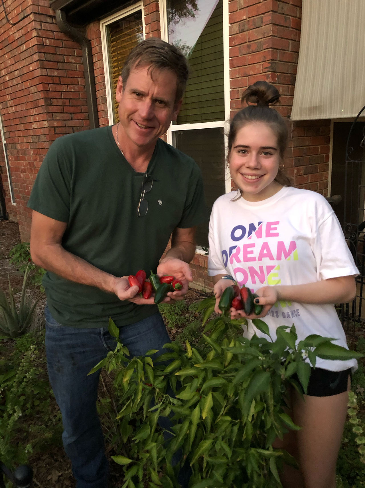 Cultivation: A Family Tradition. A photo of my father and little sister in their garden (2020)