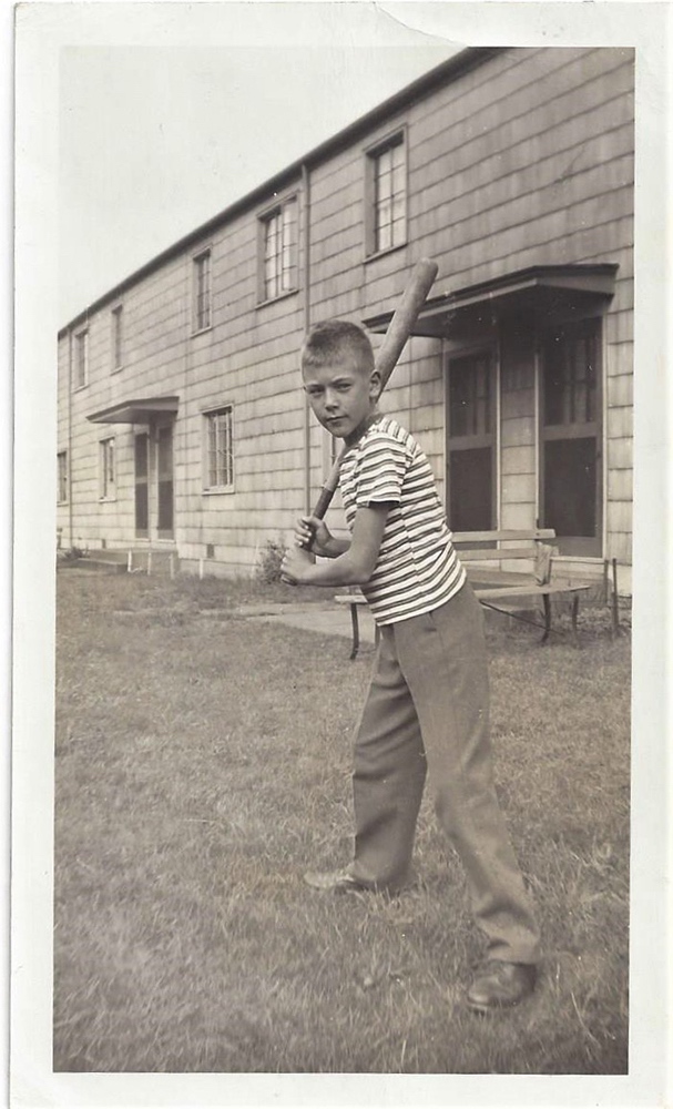 The author, Fred, outside of his apartment building, the Burns Heights housing project, a barracks style development originally designed for military housing, in Duquesne, Pennsylvania.