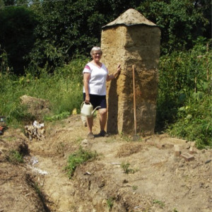 Adventures in Gardening: Highlights from a Garden Tinkerer. Dorothy and her cob obelisk.