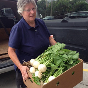 Garden Work to the Rescue. Boxes of vegetables ready for distribution.