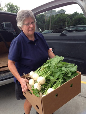 Garden Work to the Rescue. Boxes of vegetables ready for distribution.