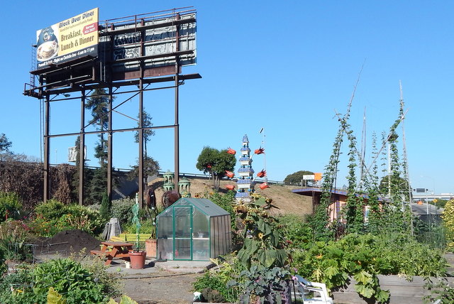 A whimsical entry sign features the namesake of Big Daddy’s Complete Rejuvenating Community Garden.