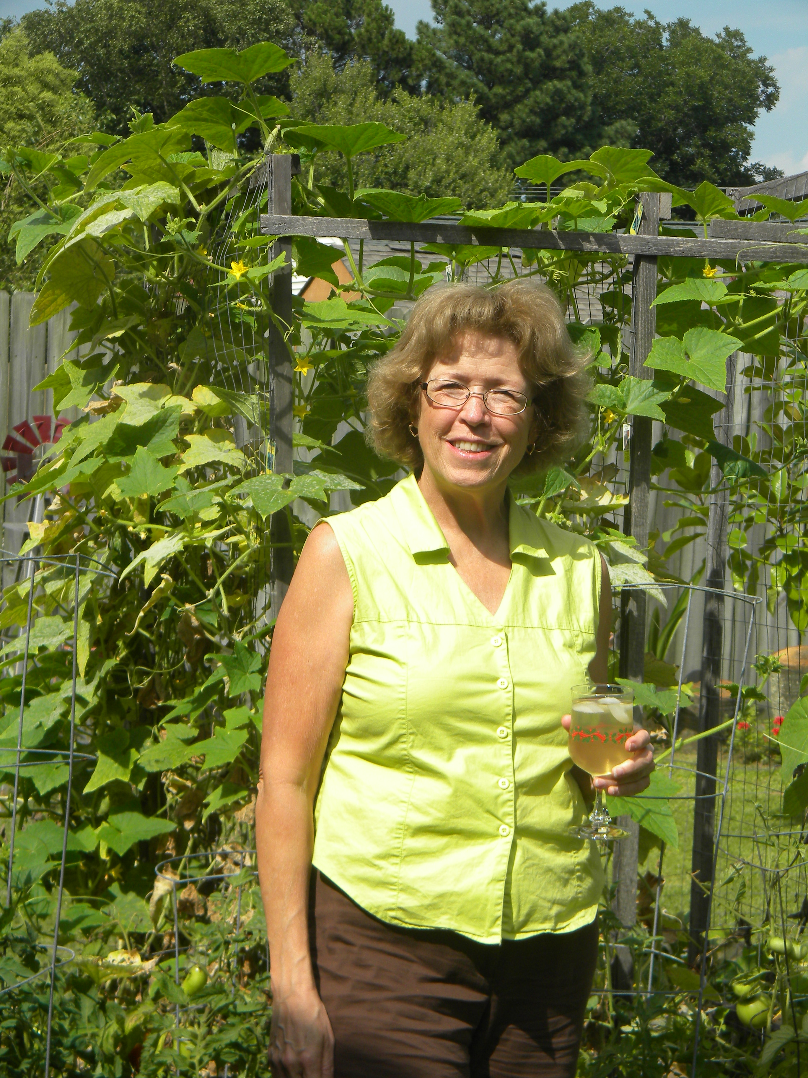 Susan's granddaughter waters the garden.